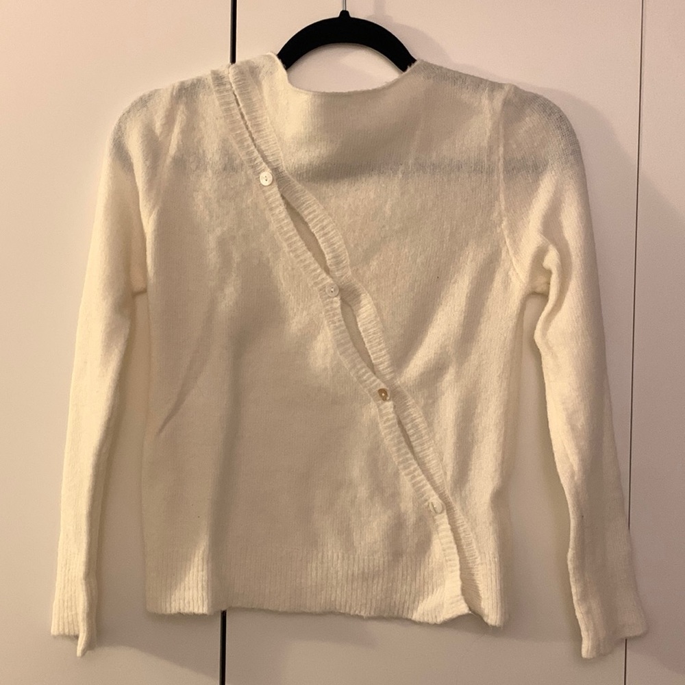 White buttoned sweater